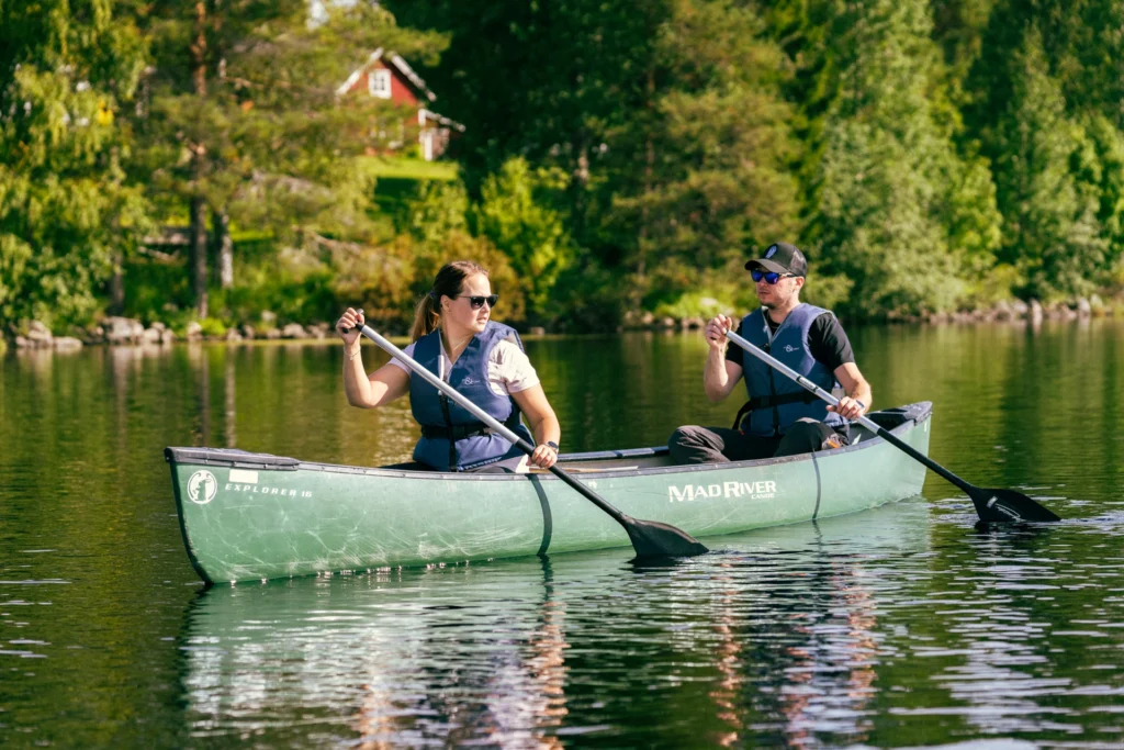 couple canoeing on a lake